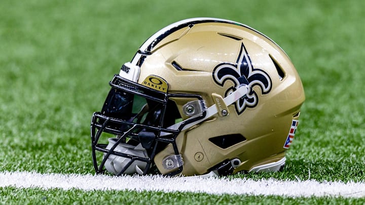 Jan 7, 2024; New Orleans, Louisiana, USA; Detailed view of the New Orleans Saints helmet during warmups against the Atlanta Falcons at Caesars Superdome. Mandatory Credit: Stephen Lew-Imagn Images