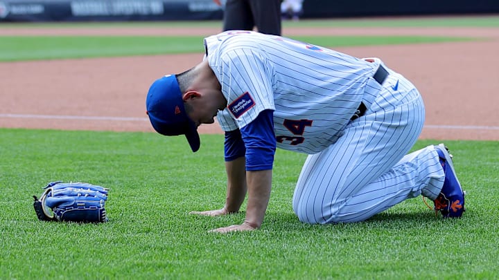 Jun 12, 2025; New York City, New York, USA; New York Mets starting pitcher Kodai Senga (34) reacts after sustaining an injury during the sixth inning against the Washington Nationals at Citi Field. Mandatory Credit: Brad Penner-Imagn Images