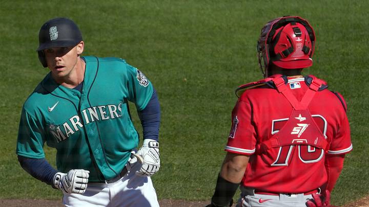 Seattle Mariners left fielder Cade Marlowe (18) crosses home plate after hitting a solo home run against the Los Angeles Angels during the fourth inning at Peoria Sports Complex on Feb. 25, 2023. Seattle Mariners left fielder Cade Marlowe (18) crosses home plate after hitting a solo home run against the Los Angeles Angels during the fourth inning at Peoria Sports Complex on Feb. 25, 2023.