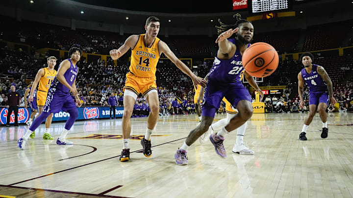 Kansas State's Kamari McGriff and Arizona State's Andrija Grbovic try to chase down a loose ball at Desert Financial Arena in Tempe. Kansas State's Kamari McGriff and Arizona State's Andrija Grbovic try to chase down a loose ball at Desert Financial Arena in Tempe.