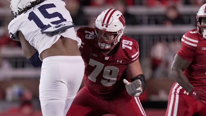 Penn State defensive end Amin Vanover (15) is blocked by Wisconsin offensive lineman Jack Nelson (79) during the first quarter of their game Saturday, October 26, 2024 at Camp Randall Stadium in Madison, Wisconsin.
