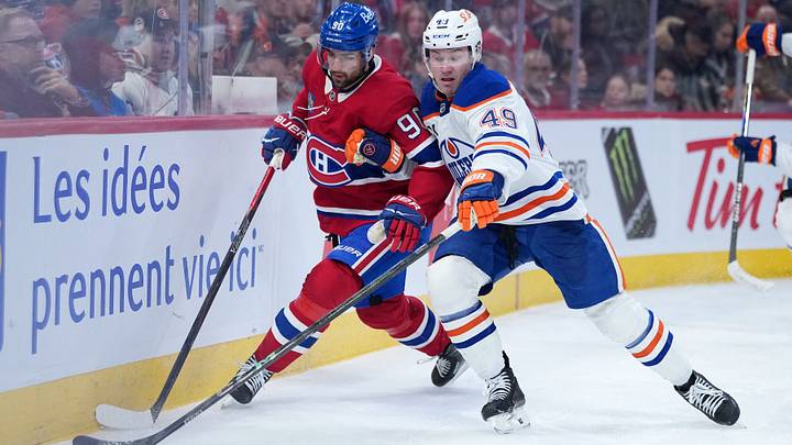 Dec 14, 2025; Montreal, Quebec, CAN; Edmonton Oilers defenseman Ty Emberson (49) plays the puck defended by Montreal Canadiens forward Joe Veleno (90) during the third period at the Bell Centre. Mandatory Credit: Eric Bolte-Imagn Images Dec 14, 2025; Montreal, Quebec, CAN; Edmonton Oilers defenseman Ty Emberson (49) plays the puck defended by Montreal Canadiens forward Joe Veleno (90) during the third period at the Bell Centre. Mandatory Credit: Eric Bolte-Imagn Images