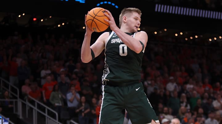 Mar 30, 2025; Atlanta, GA, USA; Michigan State Spartans forward Jaxon Kohler (0) rebounds during the first half in the South Regional final of the 2025 NCAA tournament against the Auburn Tigers at State Farm Arena. Mandatory Credit: Brett Davis-Imagn Images