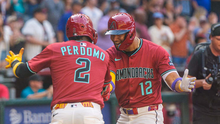 Mar 30, 2025; Phoenix, Arizona, USA; Arizona Diamondbacks outfielder Lourdes Gurriel Jr. (12) celebrates with infielder Geraldo Perdomo (2) after hitting a home run in the eighth inning against the Chicago Cubs at Chase Field. Mandatory Credit: Allan Henry-Imagn Images Mar 30, 2025; Phoenix, Arizona, USA; Arizona Diamondbacks outfielder Lourdes Gurriel Jr. (12) celebrates with infielder Geraldo Perdomo (2) after hitting a home run in the eighth inning against the Chicago Cubs at Chase Field. Mandatory Credit: Allan Henry-Imagn Images