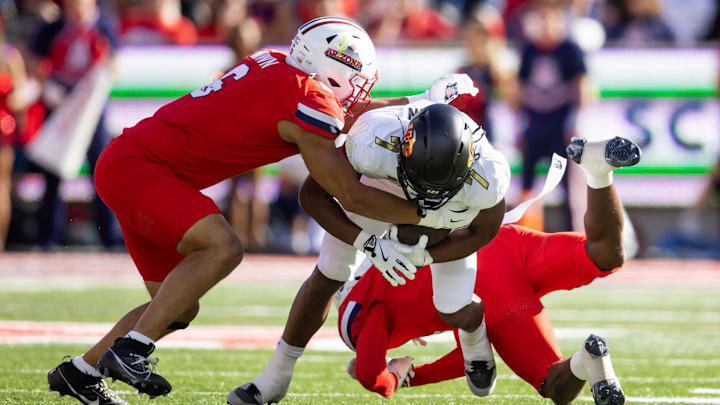 Oct 19, 2024; Tucson, Arizona, USA; Arizona Wildcats linebacker Taye Brown (6) tackles Colorado Buffalos running back Dallan Hayden (7) at Arizona Stadium. Mandatory Credit: Mark J. Rebilas-Imagn Images Oct 19, 2024; Tucson, Arizona, USA; Arizona Wildcats linebacker Taye Brown (6) tackles Colorado Buffalos running back Dallan Hayden (7) at Arizona Stadium. Mandatory Credit: Mark J. Rebilas-Imagn Images