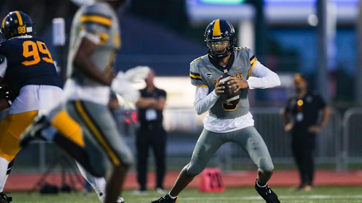 American Heritage Patriots quarterback Dia Bell (3) scrambles in the backfield during the first quarter of a game against the Naples Golden Eagles at Staver Field in Naples on Friday, Sept. 13, 2024.