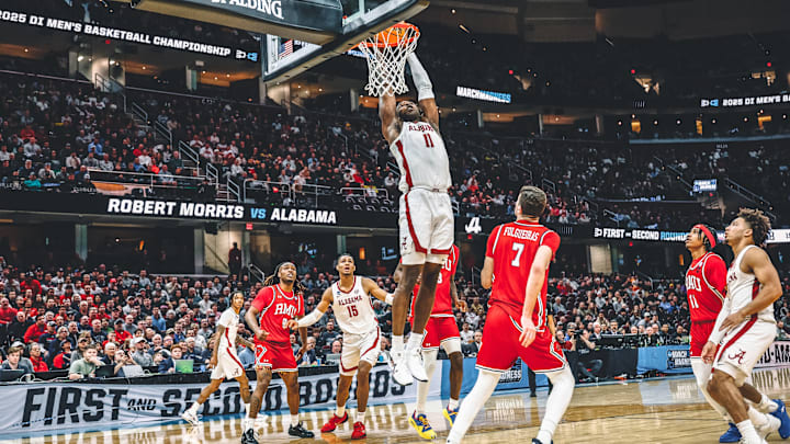 Alabama basketball's Clifford Omoruyi (11) dunks against Robert Morris. Alabama basketball's Clifford Omoruyi (11) dunks against Robert Morris.