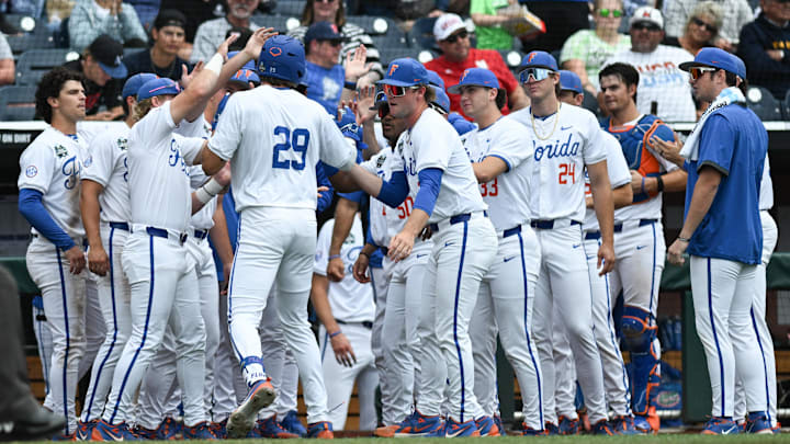 Jun 19, 2024; Omaha, NE, USA;  Florida Gators designated hitter Brody Donay (29) celebrates with the team after hitting a home run against the Kentucky Wildcats during the fifth inning at Charles Schwab Field Omaha. Mandatory Credit: Steven Branscombe-Imagn Images
