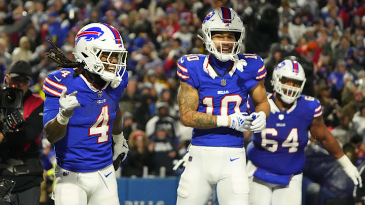 Dec 17, 2023; Orchard Park, New York, USA; Buffalo Bills running back James Cook (4) celebrates a