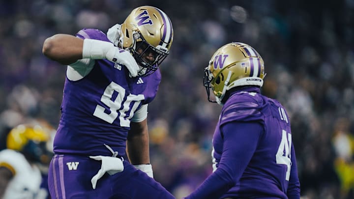 Elinneus Davis celebrates a pass deflection for the Huskies. Elinneus Davis celebrates a pass deflection for the Huskies.