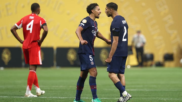 Jul 5, 2025; Atlanta, Georgia, USA; Paris Saint-Germain defender Marquinhos (5) and defender Achraf Hakimi (2) celebrate after a quarterfinal match of the 2025 FIFA Club World Cup against FC Bayern Munich at Mercedes-Benz Stadium. Mandatory Credit: Brett Davis-Imagn Images