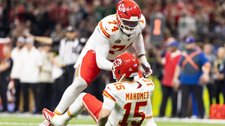Feb 9, 2025; New Orleans, LA, USA;  Kansas City Chiefs offensive tackle Jawaan Taylor (74) helps up quarterback Patrick Mahomes (15) against the Philadelphia Eagles in Super Bowl LIX at Ceasars Superdome. Mandatory Credit: Mark J. Rebilas-Imagn Images