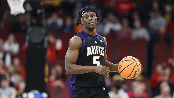 Mar 12, 2026; Chicago, IL, USA; Washington Huskies guard Zoom Diallo (5) brings the ball up court against the Wisconsin Badgers during the first half at United Center. Mandatory Credit: Kamil Krzaczynski-Imagn Images Mar 12, 2026; Chicago, IL, USA; Washington Huskies guard Zoom Diallo (5) brings the ball up court against the Wisconsin Badgers during the first half at United Center. Mandatory Credit: Kamil Krzaczynski-Imagn Images
