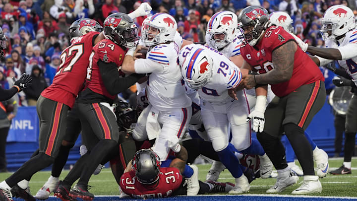 Nov 16, 2025; Orchard Park, New York, USA;  Buffalo Bills quarterback Josh Allen (17) runs the ball for a touchdown against the Tampa Bay Buccaneers during the second half of the game at Highmark Stadium.