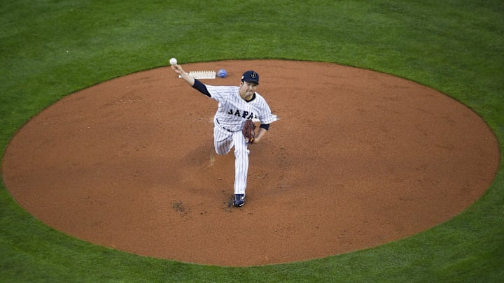 Mar 21, 2017; Los Angeles, CA, USA; Japan starting pitcher Tomoyuki Sugano (11) pitches against the United States during the first inning of the 2017 World Baseball Classic at Dodger Stadium. Mar 21, 2017; Los Angeles, CA, USA; Japan starting pitcher Tomoyuki Sugano (11) pitches against the United States during the first inning of the 2017 World Baseball Classic at Dodger Stadium.