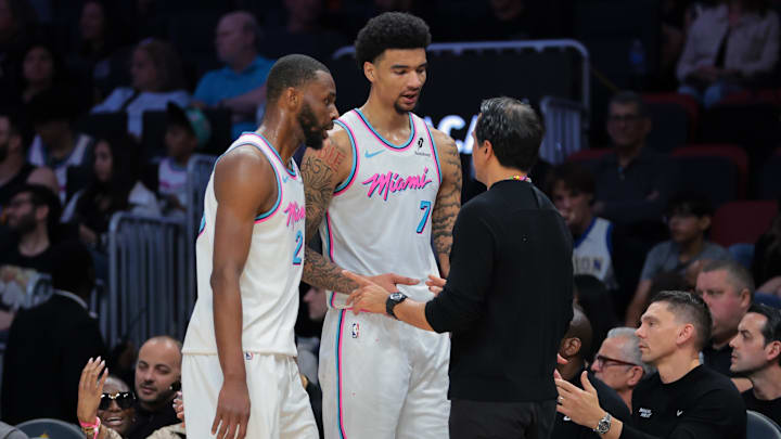 Mar 8, 2025; Miami, Florida, USA; Miami Heat head coach Erik Spoelstra talks to center Kel'el Ware (7) and forward Andrew Wiggins (22) against the Chicago Bulls during the third quarter at Kaseya Center. Mandatory Credit: Sam Navarro-Imagn Images