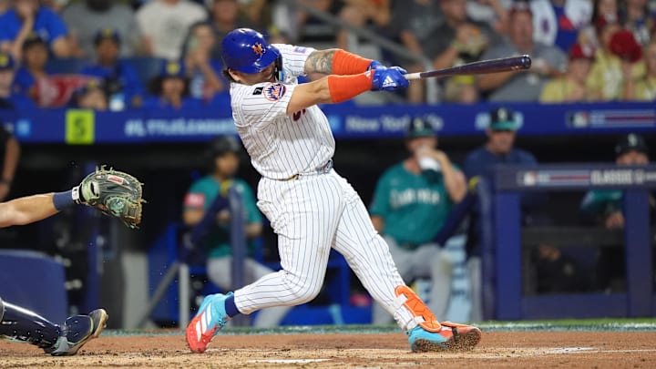 Aug 17, 2025; Williamsport, Pennsylvania, USA; New York Mets catcher Francisco Alvarez (4) hits an RBI double against the Seattle Mariners in the second inning at Journey Bank Ballpark at Historic Bowman Field. Mandatory Credit: Kyle Ross-Imagn Images