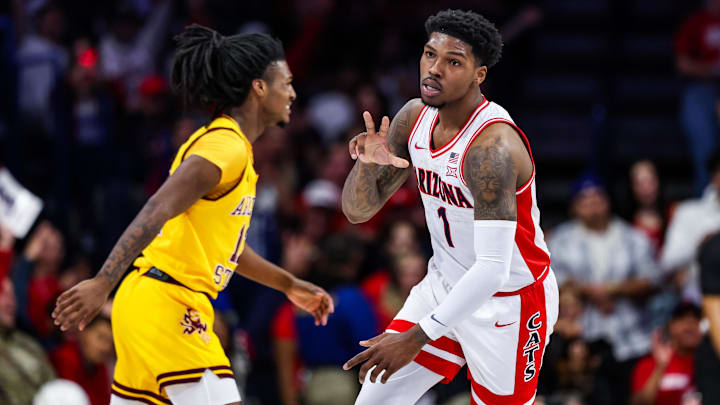 Arizona Wildcats guard Caleb Love (1) holds up a three after he shoots a three-point shot during the first half against Arizona State at McKale Center.