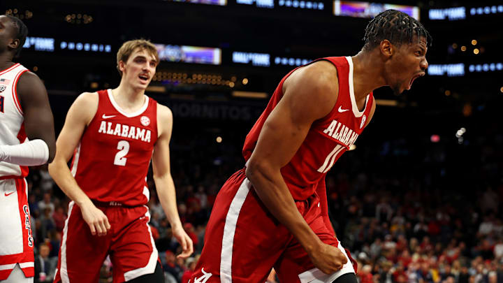 Dec 20, 2023; Phoenix, Arizona, USA; Alabama Crimson Tide forward Mohamed Wague (11) reacts after a Dec 20, 2023; Phoenix, Arizona, USA; Alabama Crimson Tide forward Mohamed Wague (11) reacts after a