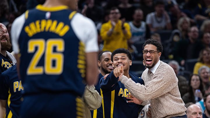 Nov 19, 2025; Indianapolis, Indiana, USA; Indiana Pacers guard RayJ Dennis (10) and guard Tyrese Haliburton (0) react to a basket in the second half against the Charlotte Hornets at Gainbridge Fieldhouse. Mandatory Credit: Trevor Ruszkowski-Imagn Images