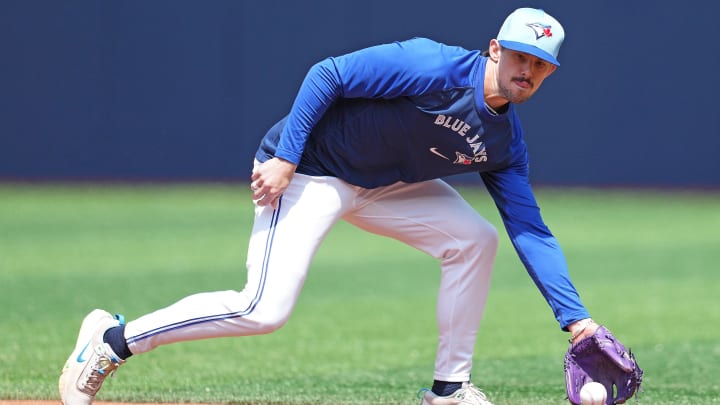 May 20, 2024; Toronto, Ontario, CAN; Toronto Blue Jays second base Cavan Biggio (8) fields balls during batting practice before a game against the Chicago White Sox at Rogers Centre.