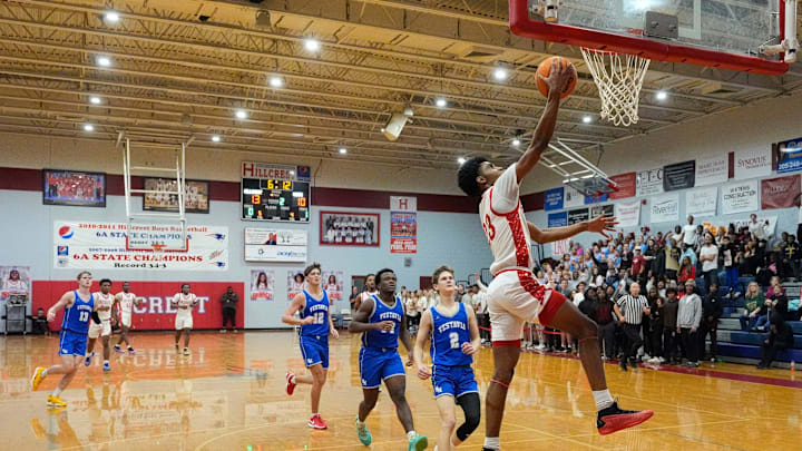 Hillcrest High's Rashaad Everette (23) gets a break away lay up against Vestavia Hills at Hillcrest High School Tuesday, Dec. 10, 2024.