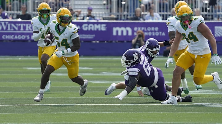 Sep 13, 2025; Evanston, Illinois, USA; Oregon Ducks linebacker Jerry Mixon (54) intercepts a pass against the Northwestern Wildcats during the second half at Northwestern Medicine Field at Martin Stadium. Mandatory Credit: David Banks-Imagn Images