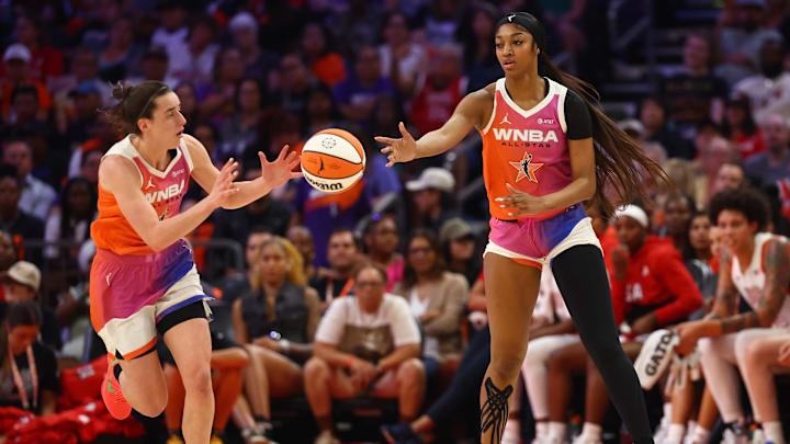 Jul 20, 2024; Phoenix, AZ, USA; Team WNBA guard Caitlin Clark (left) and Angel Reese against the USA Women's National Team during the 2024 WNBA All Star Game at Footprint Center. Mandatory Credit: Mark J. Rebilas-Imagn Images
