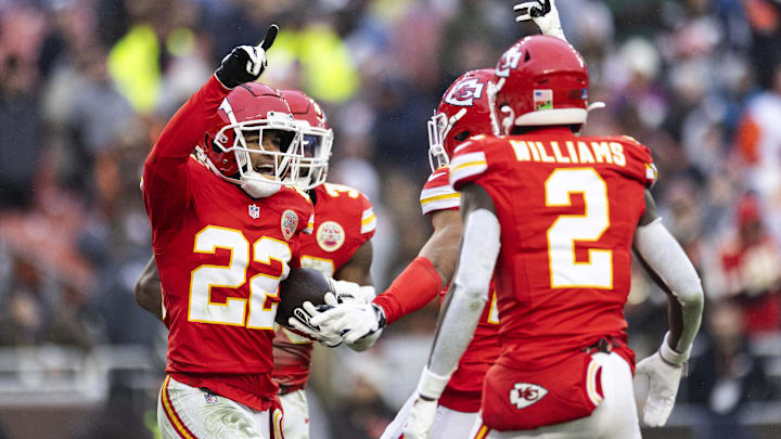 Dec 15, 2024; Cleveland, Ohio, USA; Kansas City Chiefs cornerback Trent McDuffie (22) celebrates his interception with teammates against the Cleveland Browns during the fourth quarter at Huntington Bank Field. Mandatory Credit: Scott Galvin-Imagn Images