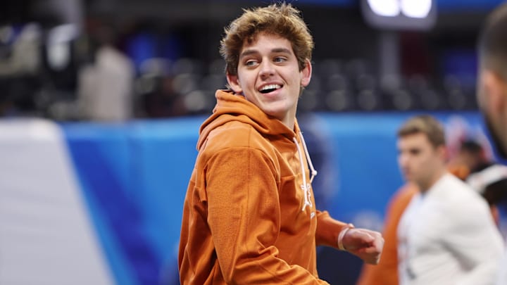 Texas Longhorns quarterback Arch Manning (16) warms up before the Peach Bowl at Mercedes-Benz Stadium.