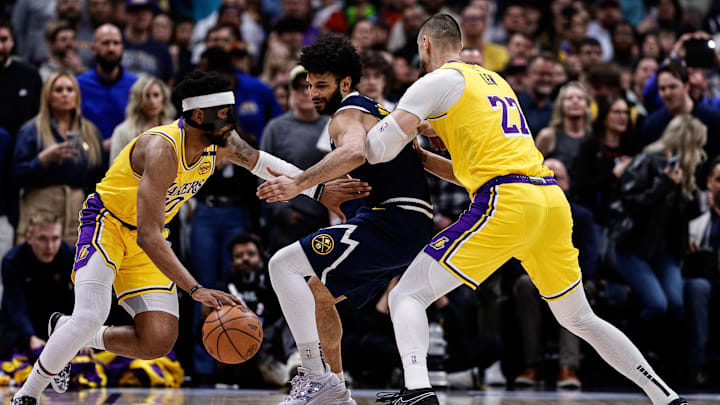 Mar 14, 2025; Denver, Colorado, USA: Los Angeles Lakers guard Jordan Goodwin (30) controls the ball as center Alex Len (27) screens against Denver Nuggets guard Jamal Murray (27) in the first quarter at Ball Arena. Mandatory Credit: Isaiah J. Downing-Imagn Images Mar 14, 2025; Denver, Colorado, USA: Los Angeles Lakers guard Jordan Goodwin (30) controls the ball as center Alex Len (27) screens against Denver Nuggets guard Jamal Murray (27) in the first quarter at Ball Arena. Mandatory Credit: Isaiah J. Downing-Imagn Images