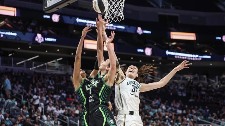 Jun 25, 2024; Belmont Park, New York, USA; Minnesota Lynx forward Alanna Smith (8) and New York Liberty forward Breanna Stewart (30) battle for a rebound in the first quarter of the Commissioner’s Cup Championship game at UBS Arena. Mandatory Credit: Wendell Cruz-USA TODAY Sports