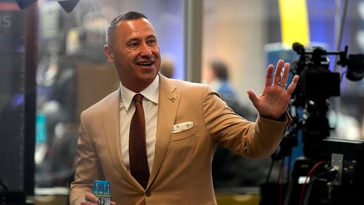 July 15, 2025; Atlanta, GA, USA; Texas head coach Steve Sarkisian waves to fans during SEC Media Days at the College Football Hall of Fame in Atlanta.