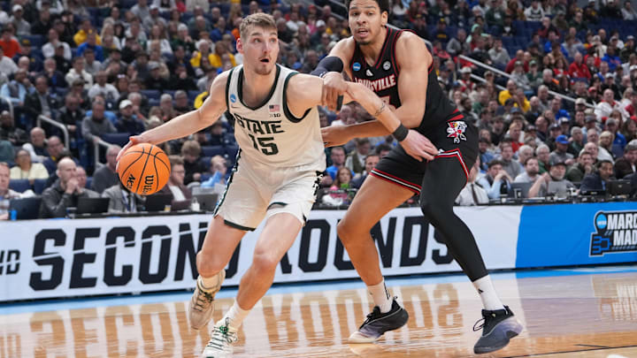 Mar 21, 2026; Buffalo, NY, USA; Michigan State Spartans center Carson Cooper (15) drives to the basket in the second half against the Louisville Cardinals during a second round game of the men's 2026 NCAA Tournament at Keybank Center. Mandatory Credit: Gregory Fisher-Imagn Images