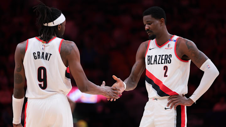 Jan 21, 2025; Miami, Florida, USA; Portland Trail Blazers center Deandre Ayton (2) shakes hands with forward Jerami Grant (9) before the third quarter against the Miami Heat at Kaseya Center. Mandatory Credit: Sam Navarro-Imagn Images