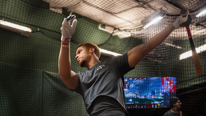 Red Sox prospect Kristian Campbell takes some swings inside the batting cage at Fenway Park on Tuesday.