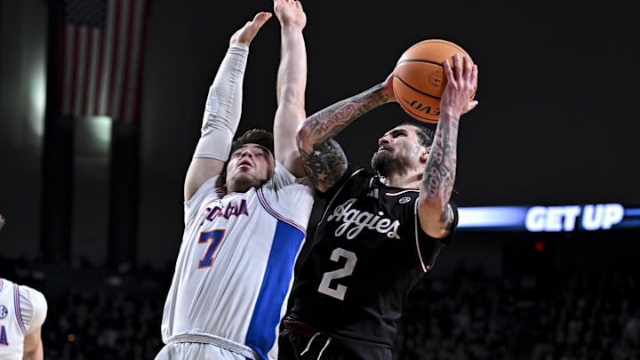 Texas A&M Aggies guard Pop Isaacs (2) goes to the basket as Florida Gators guard Urban Klavzar (7) defends during the second half at Reed Arena. 