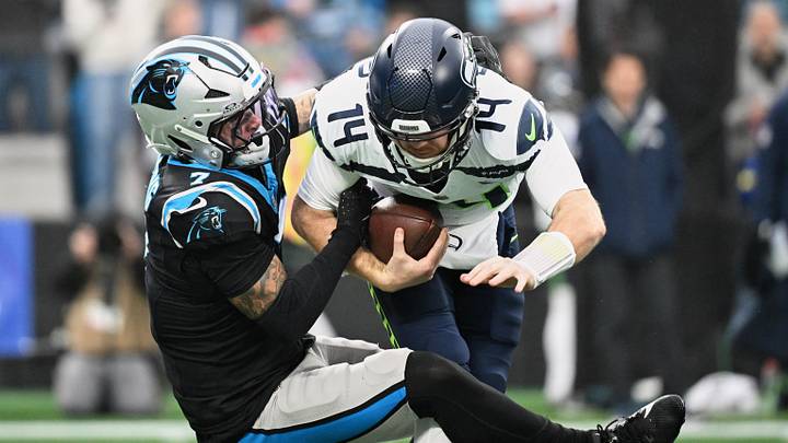 Dec 28, 2025; Charlotte, North Carolina, USA; Carolina Panthers safety Tre'von Moehrig (7) sacks Seattle Seahawks quarterback Sam Darnold (14) for a ten-yard loss during the first quarter at Bank of America Stadium. Mandatory Credit: Bob Donnan-Imagn Images Dec 28, 2025; Charlotte, North Carolina, USA; Carolina Panthers safety Tre'von Moehrig (7) sacks Seattle Seahawks quarterback Sam Darnold (14) for a ten-yard loss during the first quarter at Bank of America Stadium. Mandatory Credit: Bob Donnan-Imagn Images