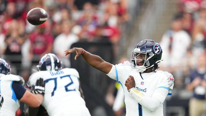 Oct 5, 2025; Glendale, Arizona, USA; Tennessee Titans quarterback Cam Ward (1) makes a throw against the Arizona Cardinals during the fourth quarter at State Farm Stadium. Mandatory Credit: Joe Camporeale-Imagn Images