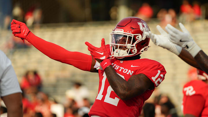 Sep 14, 2024; Houston, Texas, USA; Houston Cougars defensive back Ajani Carter (12) dances to the music pregame at TDECU Stadium. Mandatory Credit: Sean Thomas-Imagn Images