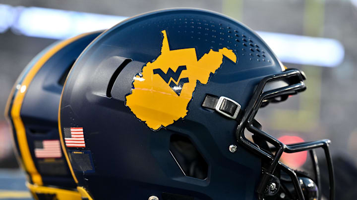 Oct 12, 2023; Houston, Texas, USA; A detailed view of a West Virginia Mountaineers helmet on the sideline during the game against the Houston Cougars  at TDECU Stadium. Mandatory Credit: Maria Lysaker-Imagn Images