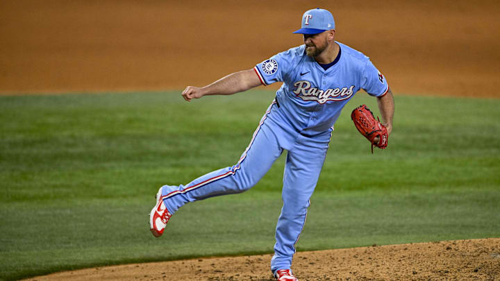 Sep 22, 2024; Arlington, Texas, USA; Texas Rangers relief pitcher Kirby Yates (39) pitches against the Seattle Mariners during the ninth inning at Globe Life Field. 