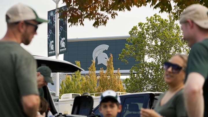 Sep 13, 2025; East Lansing, Michigan, USA; Michigan State fans tailgate at Spartan Stadium prior to a game against Youngstown State. Mandatory Credit: Brendan Mullin-Imagn Images