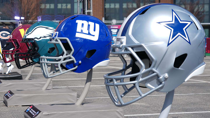 Feb 27, 2025; Indianapolis, IN, USA; NFC East helmets of the Dallas Cowboys, New York Giants, Philadelphia Eagles and Washington Commanders at the 2025 NFL Scouting Combine Experience at Lucas Oil Stadium. Mandatory Credit: Kirby Lee-Imagn Images
