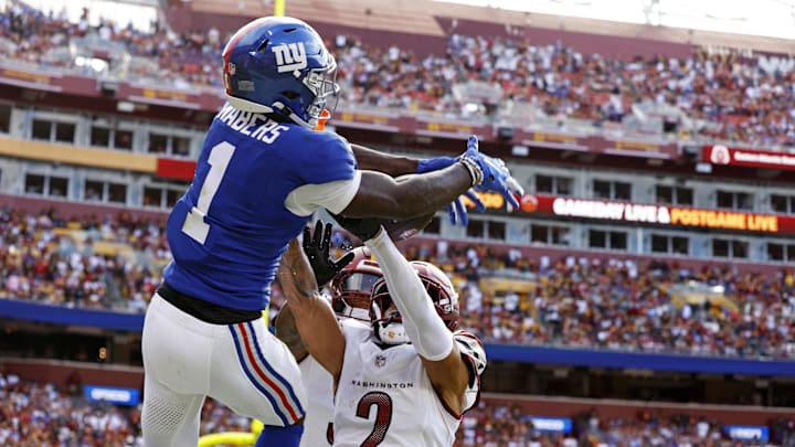 Sep 7, 2025; Landover, Maryland, USA; New York Giants wide receiver Malik Nabers (1) jumps up to make a catch during the fourth quarter against the Washington Commanders at Northwest Stadium. Mandatory Credit: Peter Casey-Imagn Images