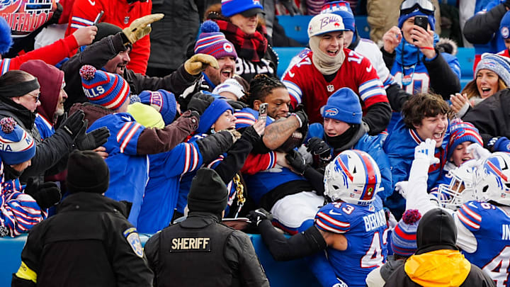Buffalo Bills safety Damar Hamlin celebrates with the fans his interception during the second half of the Buffalo Bills wild card game against the Denver Broncos.