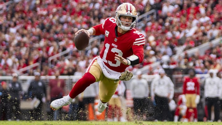 November 17, 2024; Santa Clara, California, USA; San Francisco 49ers quarterback Brock Purdy (13) runs the football against the Seattle Seahawks during the first quarter at Levi's Stadium. Mandatory Credit: Kyle Terada-Imagn Images