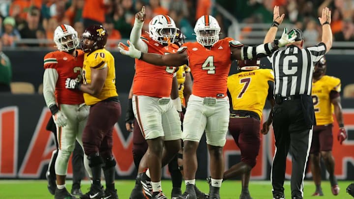 Sep 6, 2025; Miami Gardens, Florida, USA; Miami Hurricanes defensive lineman Rueben Bain Jr. (4) reacts after a sack against the Bethune-Cookman Wildcats during the third quarter at Hard Rock Stadium. Mandatory Credit: Sam Navarro-Imagn Images Sep 6, 2025; Miami Gardens, Florida, USA; Miami Hurricanes defensive lineman Rueben Bain Jr. (4) reacts after a sack against the Bethune-Cookman Wildcats during the third quarter at Hard Rock Stadium. Mandatory Credit: Sam Navarro-Imagn Images