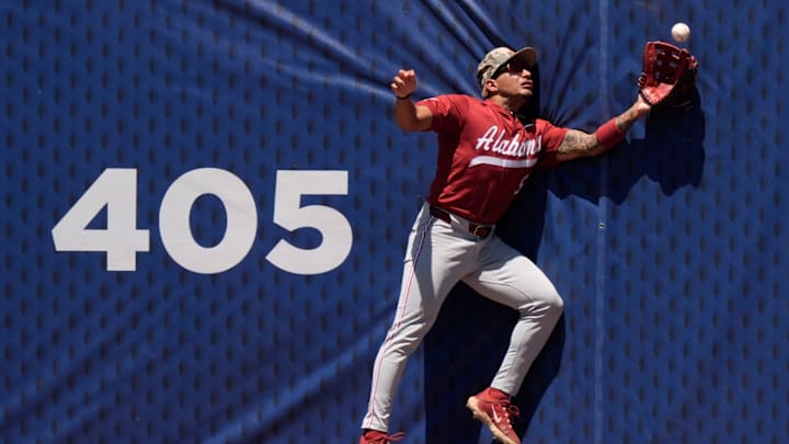 May 21, 2025; Hoover, AL, USA; Alabama centerfielder Richie Bonomolo Jr. (5) makes a leaping catch against the centerfield fence during the game with Tennessee in the second round of the SEC Baseball Tournament at the Hoover Met.