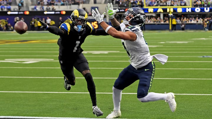 Nov 16, 2025; Inglewood, California, USA; Los Angeles Rams cornerback Emmanuel Forbes Jr. (1) breaks up a pass intended for Seattle Seahawks wide receiver Jaxon Smith-Njigba (11) during the first half at SoFi Stadium.